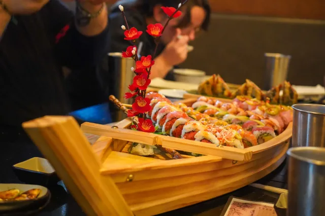 A boat-shaped platter filled with sushi