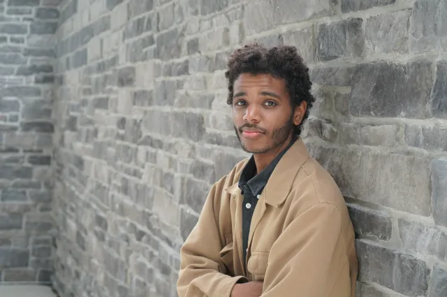 A thoughtful portrait against the stone wall