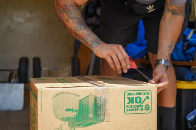 Packing and taping a moving box